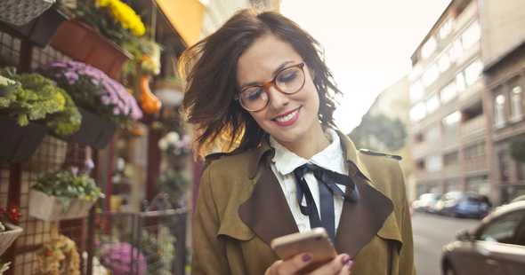 This image shows a woman using Dex Crypto Hub to exchange her tokens. She is smiling because she is happy to be able to trade tokens directly with other users on a platform that's trusted and easy to use without having to use a centralized exchange. DEXs are peer-to-peer exchanges that allow users to trade tokens directly with each other without having to trust a third party. This is a valuable feature for crypto investors who want to avoid the fees and risks associated with centralized exchanges. Woman using a decentralized exchange, smiling