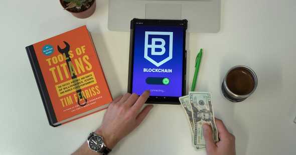 This image shows a blockchain transaction in progress. Blockchains are decentralized ledgers that record transactions in blocks. Crypto transactions are transactions that involve cryptocurrencies. Blockchain transaction in progress